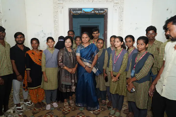 With teachers and students at the school laboratory