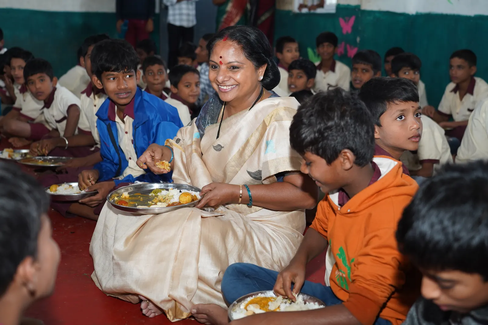 K Kavitha sharing the midday meal with schoolchildren