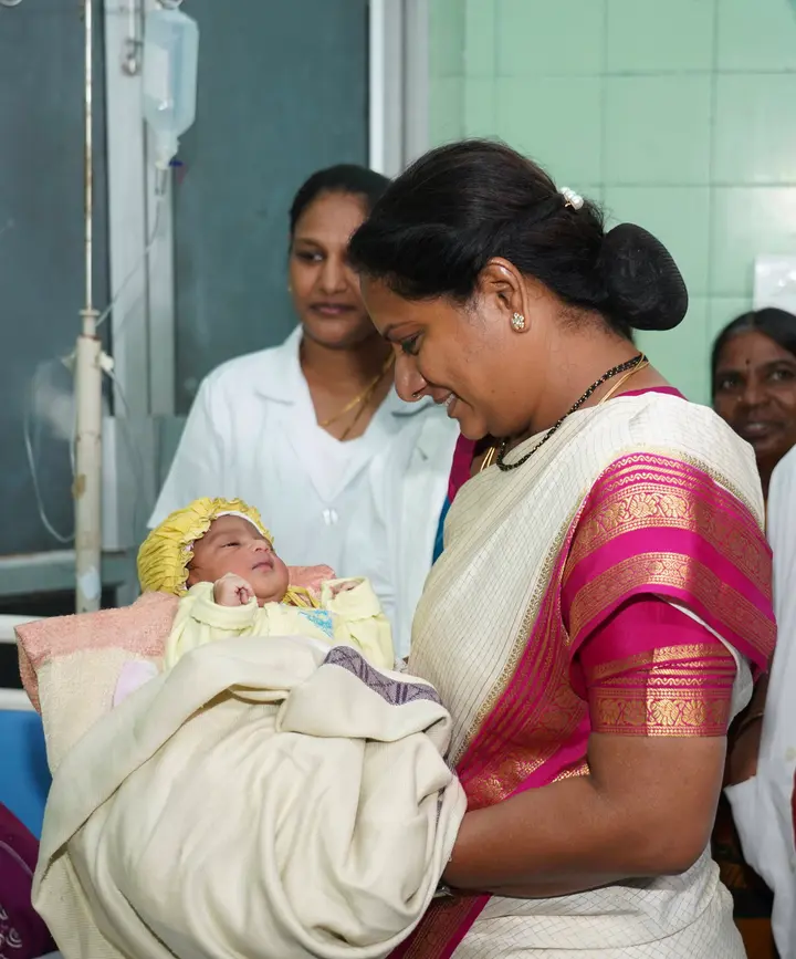 Holding a newborn on the ward