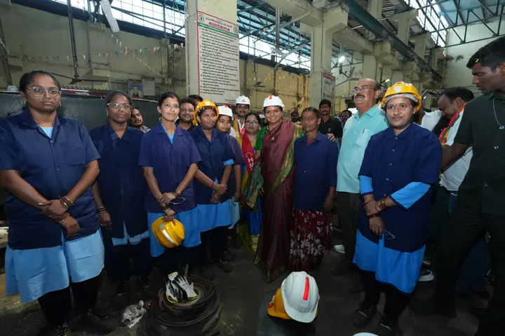 With the women of the workshop floor